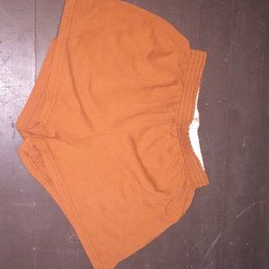 Burt orange/ rust colored Texas shorts.